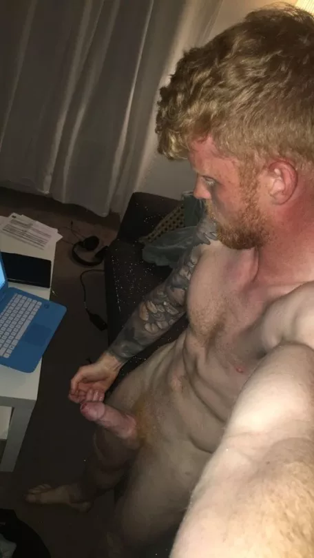 Looking down at his ginger cock