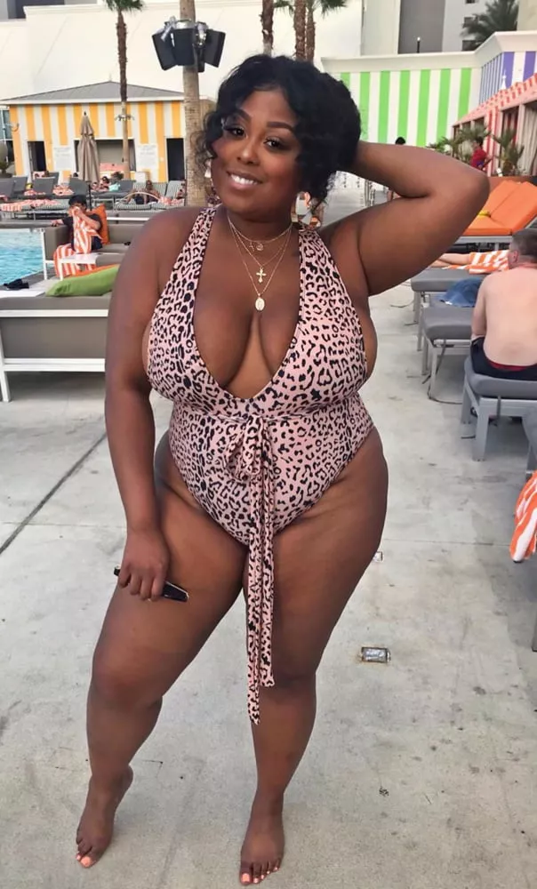 Plump beauty in an animal print one piece