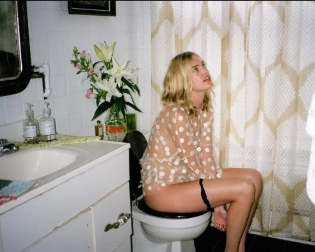 Potty blonde day dreaming with black panties.