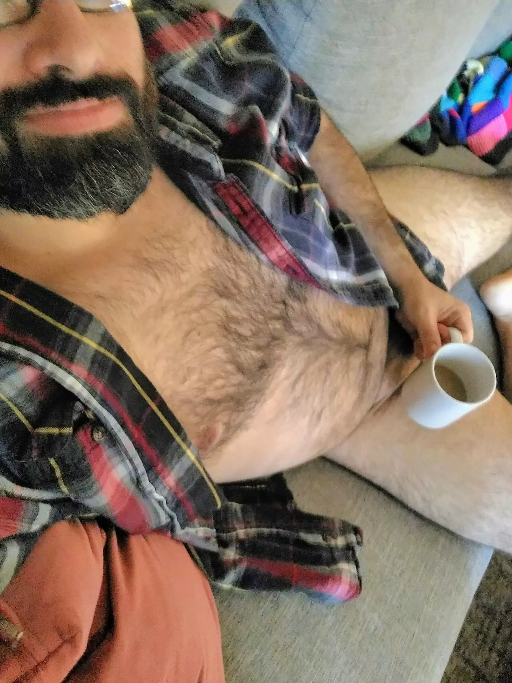 POV, you walk in and having a cup on the sofa.