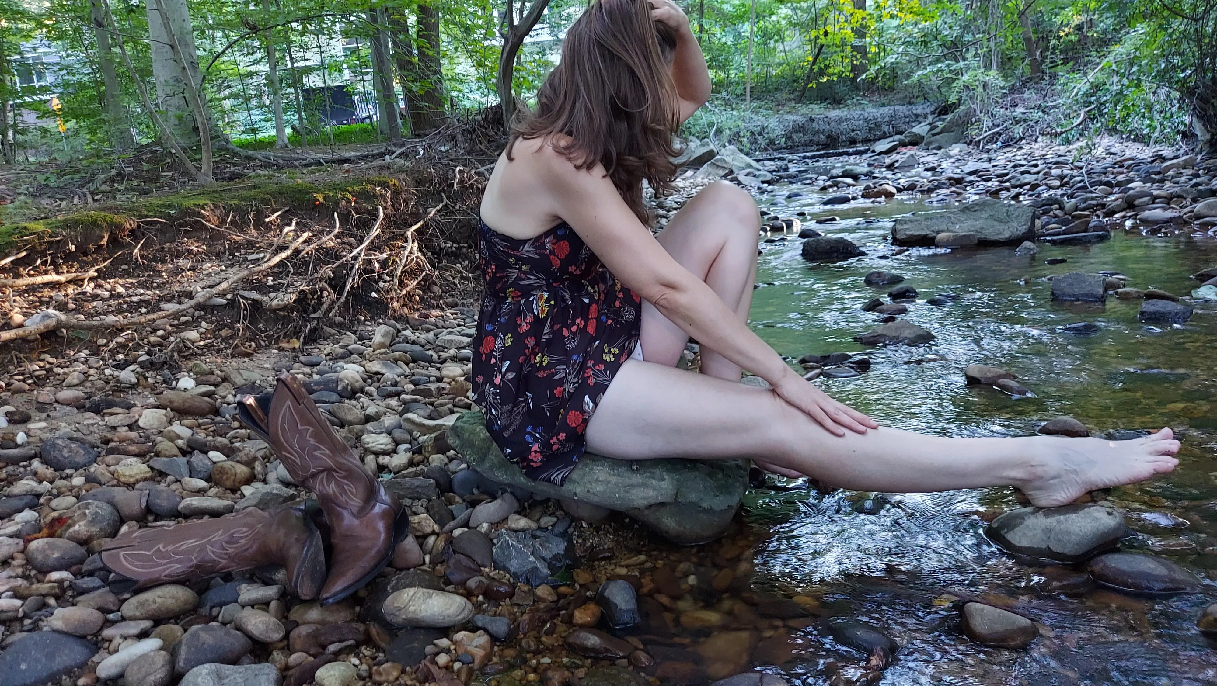 Relaxing by the water with my cowgirl boots ðŸ¥°