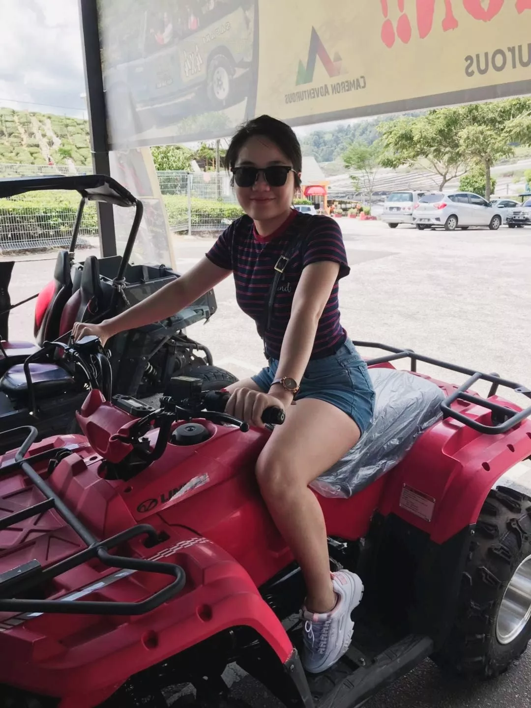 sexy gal with thick thighs in jeans shorts on an atv