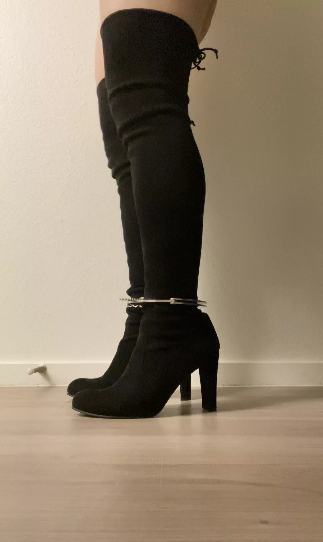 Shackled in thigh high boots!