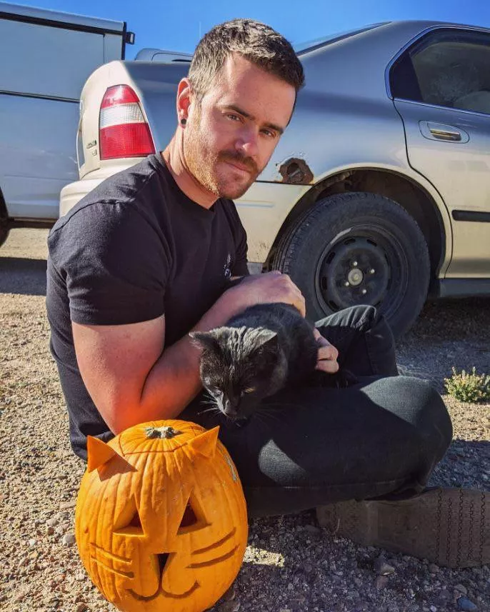 The neighbor and I carved pumpkins in honor of this cat that hangs out in our dumpster. Her name is Garbage and sometimes she smells like pizza.