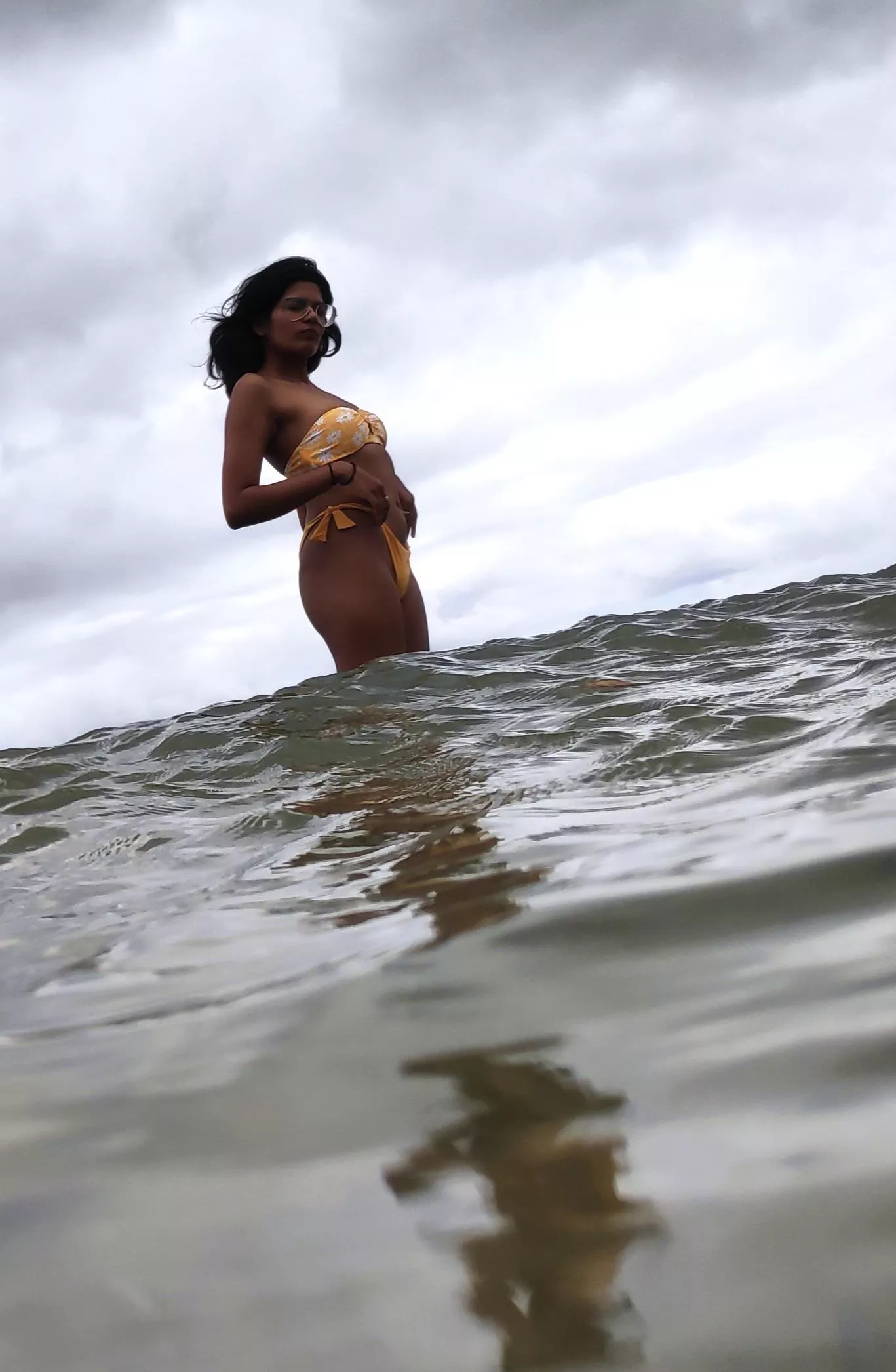 Yellow bikini and rough sea